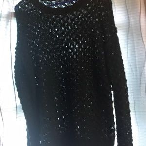 Green open crochet sweater.